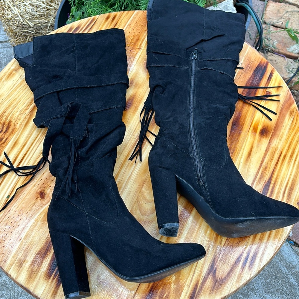 Rouged tall black heeled boots